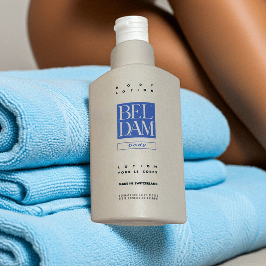 Beldam Body Lotion 17 fl oz Swiss-made moisturizer with lightweight, hydrating formula and vitamin E on blue towels
