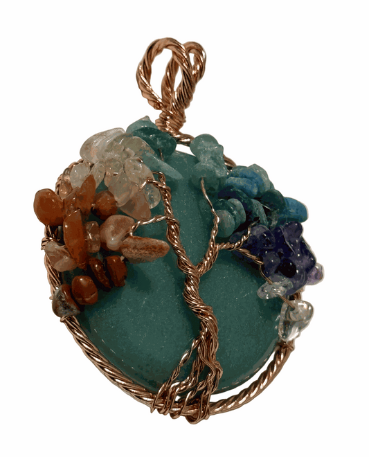 Wire-wrapped pendant featuring colorful stones symbolizing strength and resilience, The Weight of What I Built.