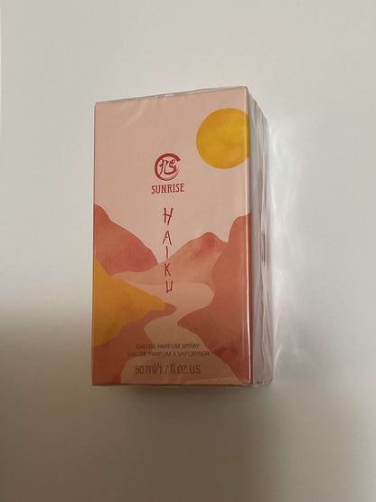 Haiku Sunrise Eau De Perfume 1.7 fl oz packaging with sunrise and mountain design