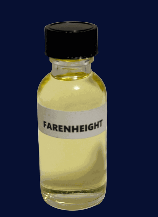 small bottle of Fahrenheit Perfume Oil with warm amber and woody notes