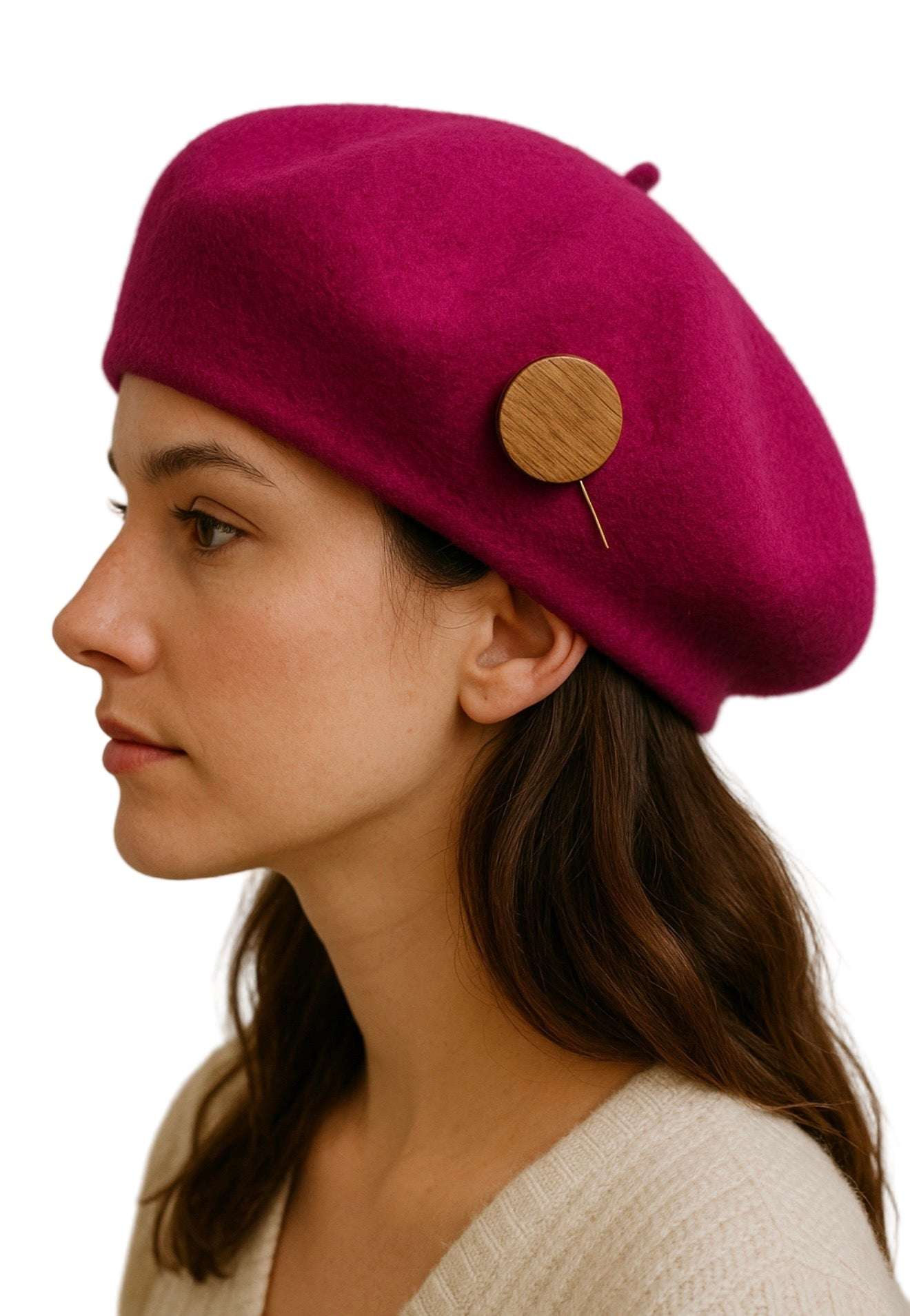 Woman wearing magenta beret with handmade Mahogany Heritage Accent Pin attached