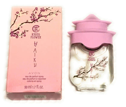 Kyoto Flower Haiku Eau De Perfume Spray with violet leaves and white peony fragrance in 1.7 fl oz bottle and pink packaging