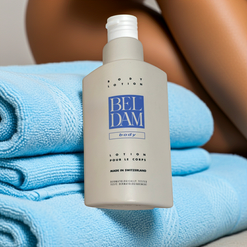 Beldam Body Lotion 17 fl oz Swiss-made moisturizer with lightweight, hydrating formula and vitamin E on blue towels