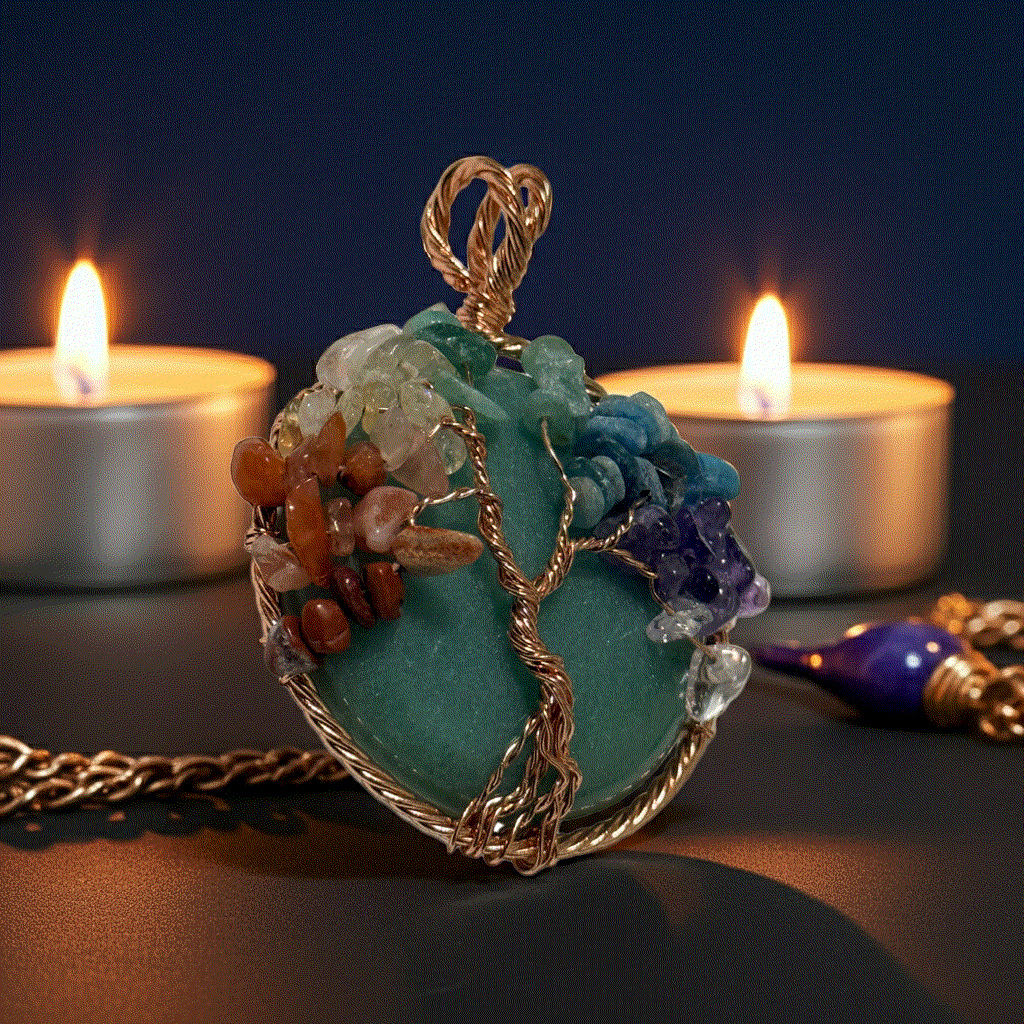 7 Chakra Tree Of Life pendant with green aventurine and copper wire wrapping on black leather cord