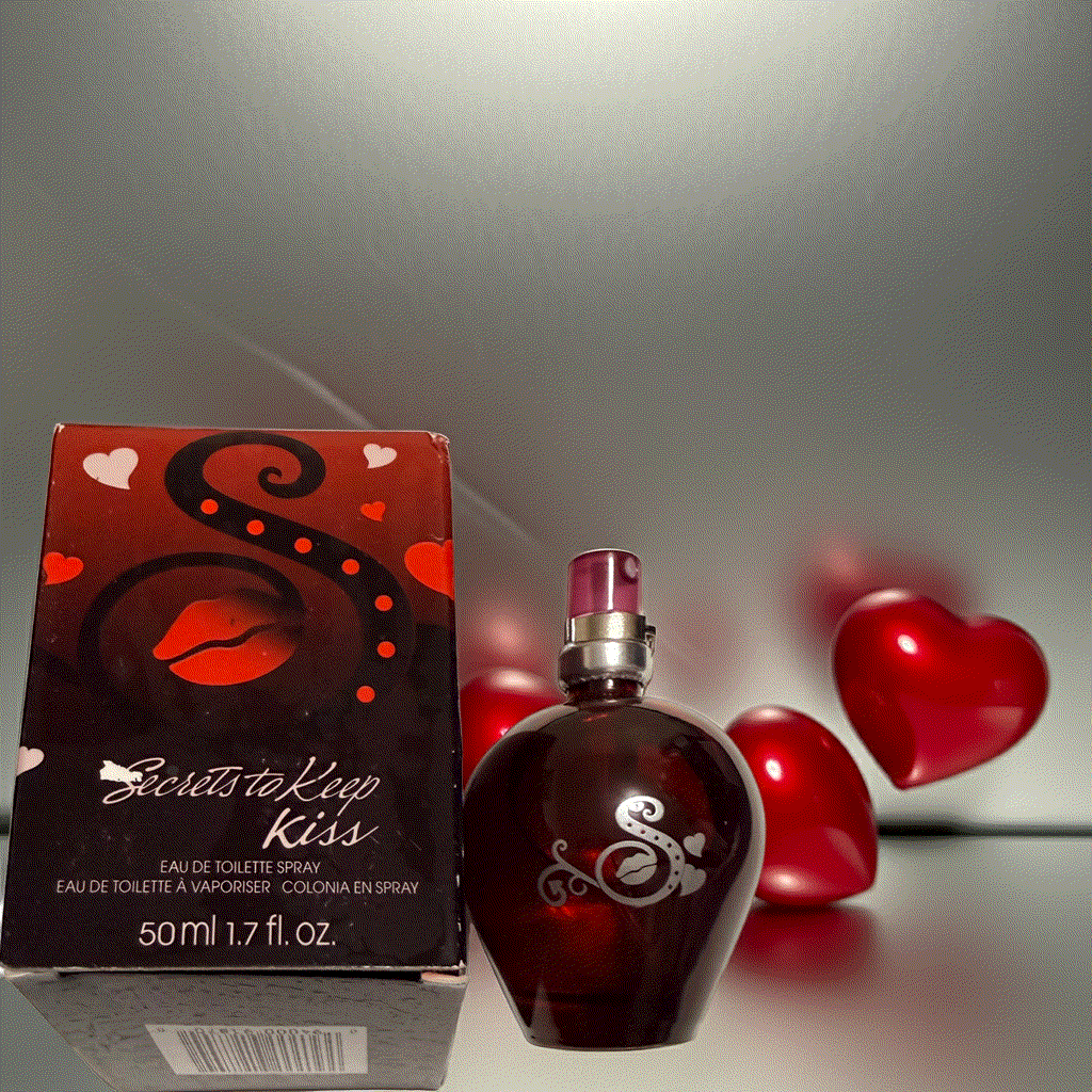Secrets to Keep Kiss eau de toilette spray in heart-shaped bottle with red lips and hearts on box, 1.7 fl oz fragrance