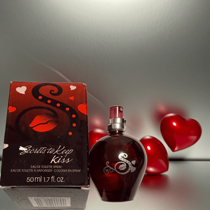 Secrets to Keep Kiss eau de toilette spray in heart-shaped bottle with red lips and hearts on box, 1.7 fl oz fragrance