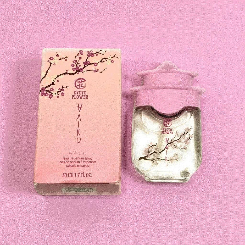 Kyoto Flower Haiku perfume bottle and pink cherry blossom packaging on pink background