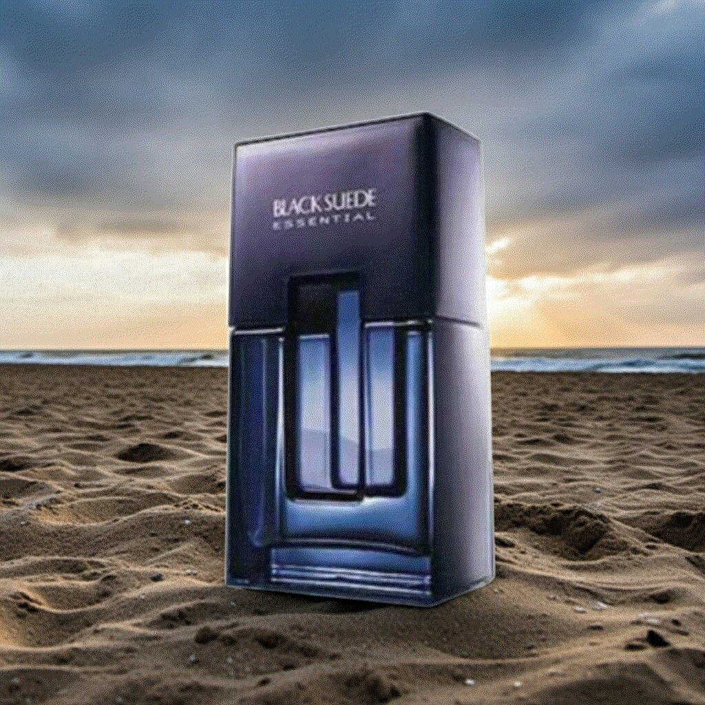 Black Suede Essentials men's cologne bottle and packaging on sandy beach at sunset