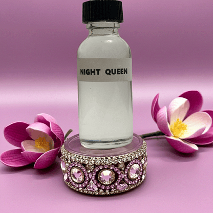 Night Queen perfume oil bottle on jeweled stand with pink flowers and purple background