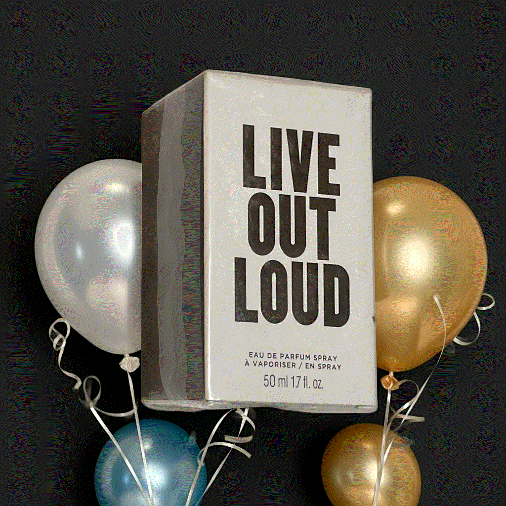 Avon Live Out Loud Eau De Perfume Spray 1.7 fl oz with wild strawberry, mimosa, and vanilla fragrance notes surrounded by festive balloons